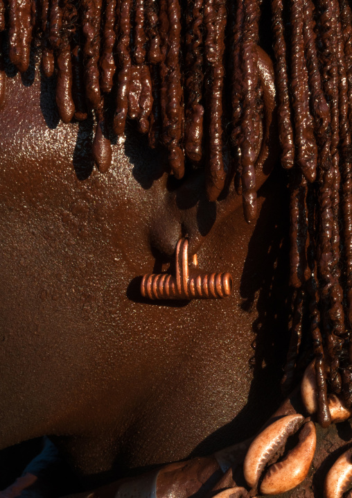 Close up of a brass earring of a hamer tribe girl, Omo valley, Turmi, Ethiopia