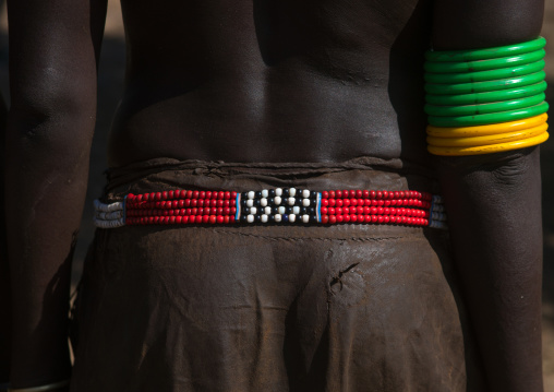 Nyangatom tribe woman with a beaded belt, Omo valley, Kangate, Ethiopia