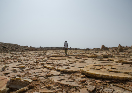 Afar man in the volcanic formations of the danakil depression, Afar region, Dallol, Ethiopia