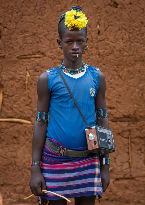 Bana tribe man with yellow plastic flower in the hair, Omo valley, Key afer, Ethiopia