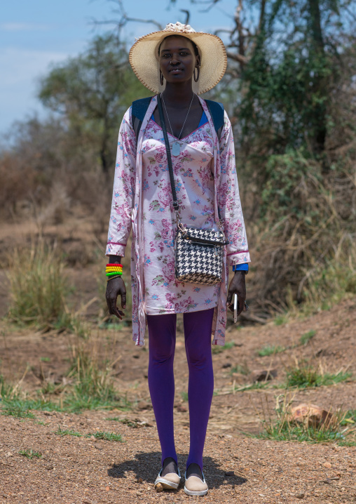 Young mursi tribe woman dressed in western clothes to go in town, Omo valley, Hana mursi, Ethiopia