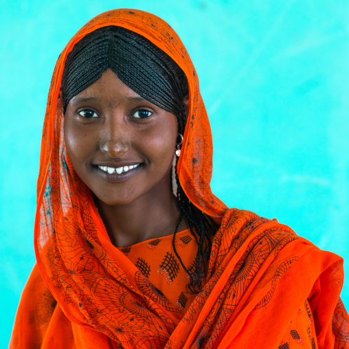 Portrait of an afar tribe girl with braided hair and sharpened teeth, Afar region, Semera, Ethiopia