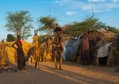 Dassanech man preparing himself for dimi ceremony to celebrate the circumcision of the teenagers, Omo valley, Omorate, Ethiopia