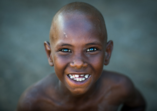 Smiling afar tribe boy with broken teeth, Afar region, Afambo, Ethiopia
