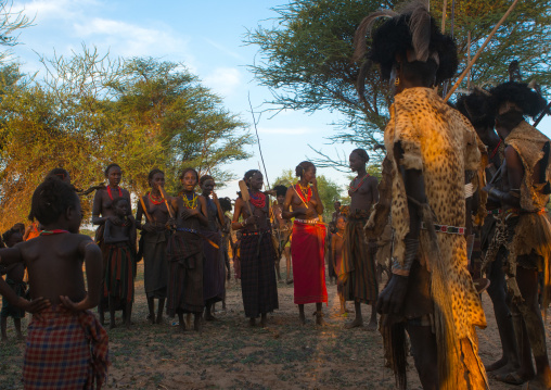Dassanech men and women during dimi ceremony to celebrate circumcision of teenagers, Omo valley, Omorate, Ethiopia