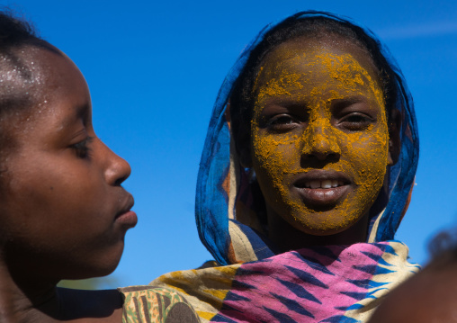 Afar tribe teenage girl with qasil on her face, Afar region, Afambo, Ethiopia