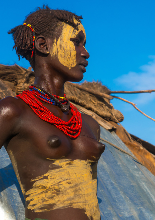 Dassanech tribe teenage girl during dimi ceremony to celebrate circumcision of teenagers, Omo valley, Omorate, Ethiopia