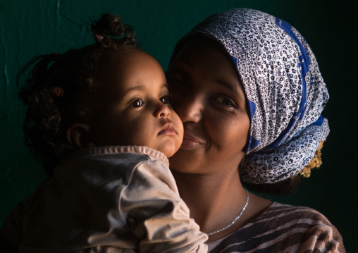 Sufi mother kissing her baby, Harari region, Harar, Ethiopia