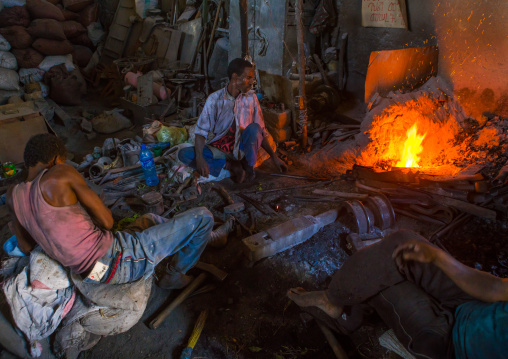 Two blacksmiths in their workshop, Harari region, Harar, Ethiopia