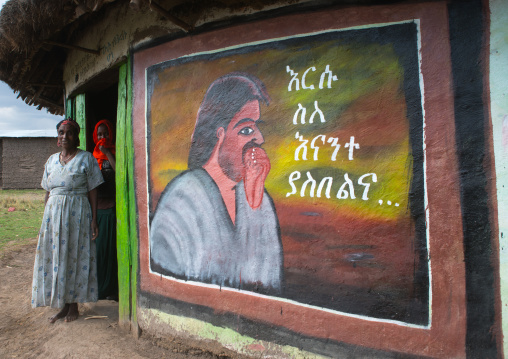 Ethiopia, Kembata, Alaba Kuito, christian women standing in front of their traditional painted house