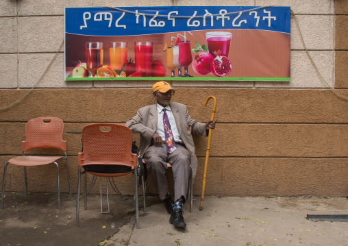 Ethiopia, Kembata, Alaba Kuito, old man in a suit sitting in a bar