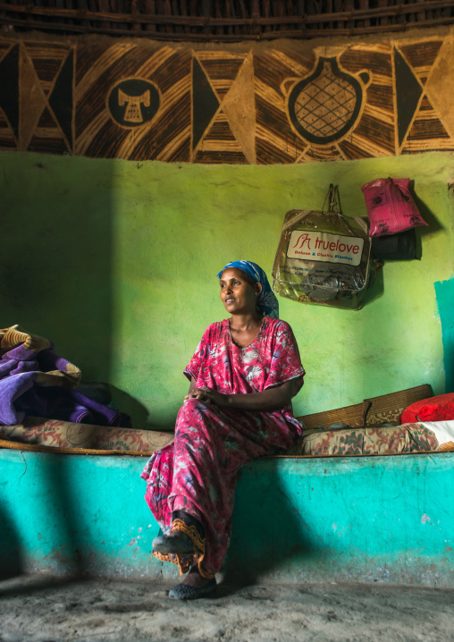 Ethiopia, Kembata, Alaba Kuito, ethiopian woman inside her traditional painted and decorated house