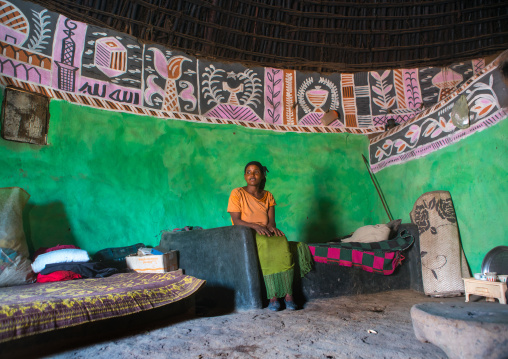 Ethiopia, Kembata, Alaba Kuito, ethiopian woman inside her traditional painted and decorated house
