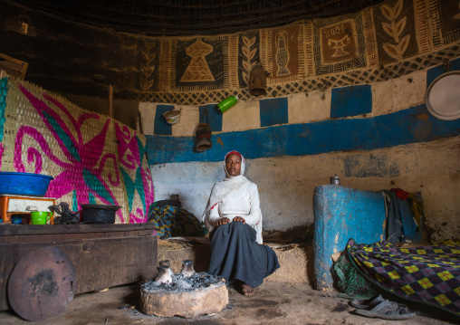 Ethiopia, Kembata, Alaba Kuito, ethiopian woman inside her traditional painted and decorated house