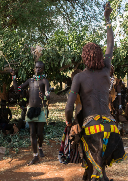 Hamer tribe woman waiting to be whipped during a bull jumping ceremony, Omo valley, Turmi, Ethiopia