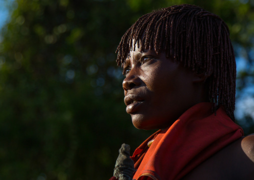 Hamer tribe woman waiting to be whipped during a bull jumping ceremony, Omo valley, Turmi, Ethiopia