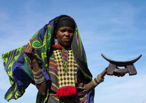 Issa tribe woman with a wooden pillow, Afar region, Yangudi Rassa National Park, Ethiopia