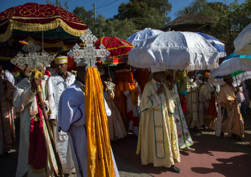 Ethiopian priests carrying some covered tabots on their heads during Timkat epiphany festival, Amhara region, Lalibela, Ethiopia