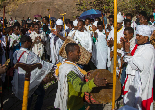 Ethiopian orthodox priest procession celebrating the colorful Timkat epiphany festival, Amhara region, Lalibela, Ethiopia