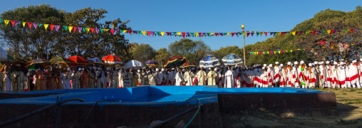 Priests in front of the pool during Timkat celebrations of epiphany, Amhara region, Lalibela, Ethiopia