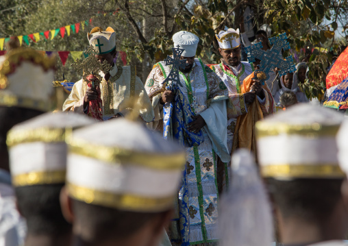 Priests in front of the pool blessing the holy water during Timkat celebrations of epiphany, Amhara region, Lalibela, Ethiopia