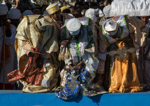 Priests in front of the pool blessing the holy water during Timkat celebrations of epiphany, Amhara region, Lalibela, Ethiopia