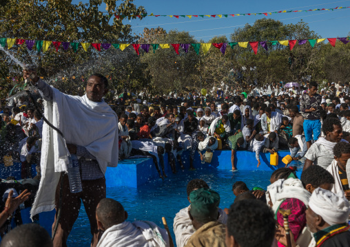 Holy water sprayed onto the crowd attending Timkat celebrations of epiphany, Amhara region, Lalibela, Ethiopia