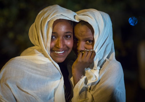 Orthodox pilgrims teenagers during Timkat epiphany festival at night, Amhara region, Lalibela, Ethiopia