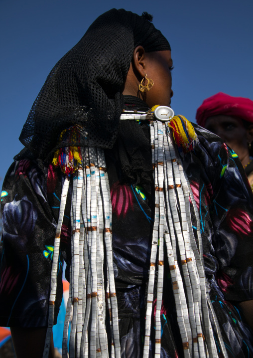 Oromo woman back with metal jewelry that shows she is engaged, Amhara region, Senbete, Ethiopia