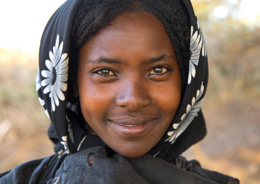 Portrait of a smiling Borana tribe young woman, Oromia, Yabelo, Ethiopia