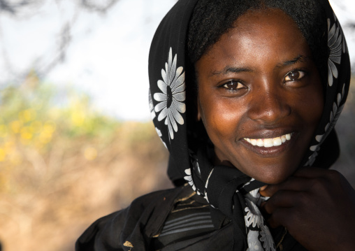 Portrait of a smiling Borana tribe young woman, Oromia, Yabelo, Ethiopia