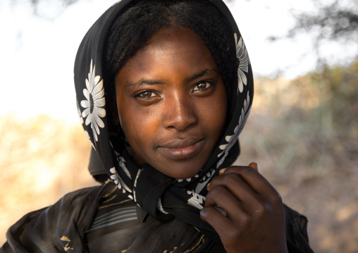 Portrait of a smiling Borana tribe young woman, Oromia, Yabelo, Ethiopia
