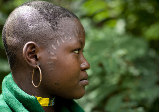Menit woman with decorative scarifications on the face, Tum market, Omo valley, Ethiopia