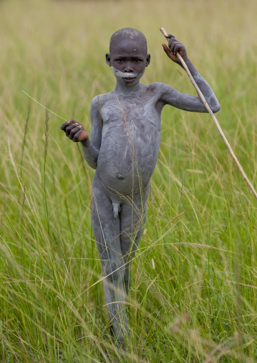 Suri Boy Imitating The Adult Warriors, Omo Valley, Ethiopia