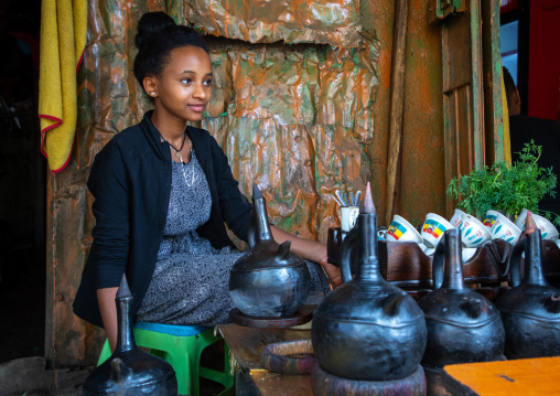 Ethiopian woman preparing coffee in a bar, Harari region, Harar, Ethiopia