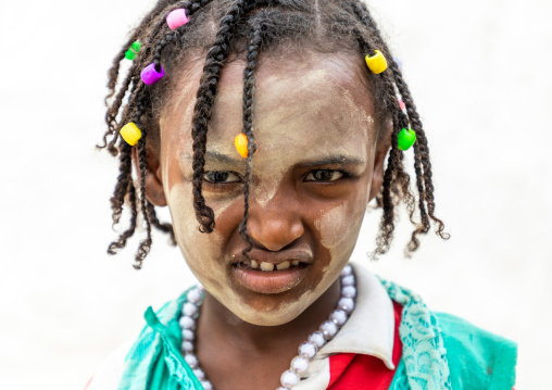 Oromo pilgrim girl in Sheikh Hussein shrine with jarawa powder on the face, Oromia, Sheik Hussein, Ethiopia