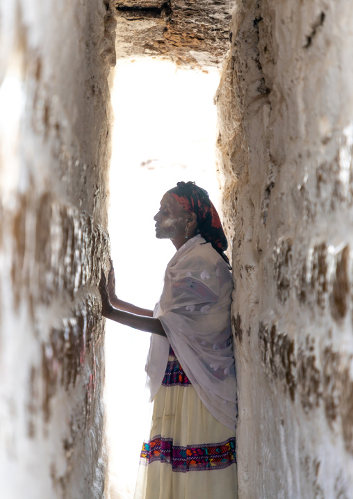 Oromo pilgrim in Sheikh Hussein shrine in a symbolic narrow corridor, Oromia, Sheik Hussein, Ethiopia