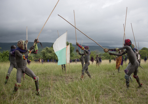 Suri tribe warriors fighting during a donga stick ritual, Omo valley, Tulgit, Ethiopia