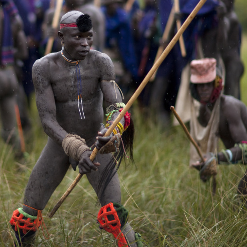 Suri tribe warriors fighting during a donga stick ritual, Omo valley, Tulgit, Ethiopia