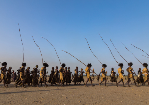 Dassanech men with leopard skins and ostrich feathers wigs during Dimi ceremony to celebrate circumcision of teenagers, Turkana County, Omorate, Ethiopia