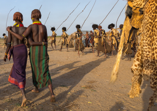 Dassanech men with leopard skins and ostrich feathers wigs during Dimi ceremony to celebrate circumcision of teenagers, Turkana County, Omorate, Ethiopia