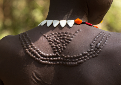 Sudanese Toposa tribe woman refugee with scarifications on her body, Omo Valley, Kangate, Ethiopia