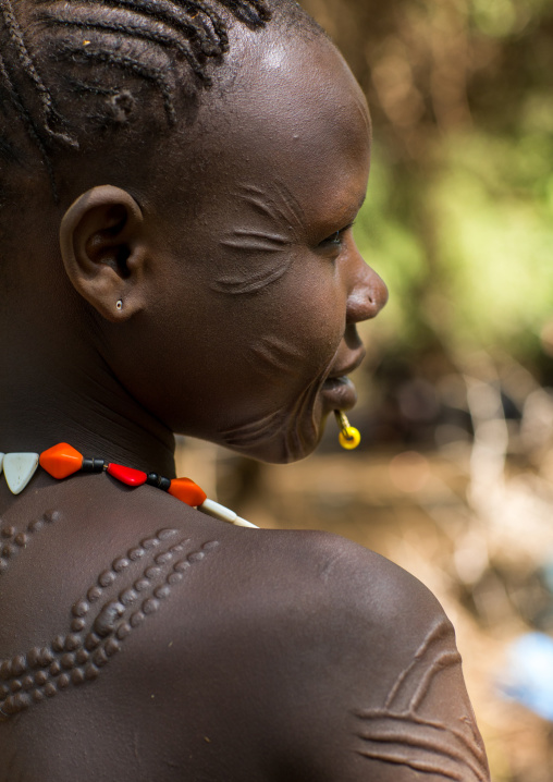 Sudanese Toposa tribe woman refugee with scarifications on her body, Omo Valley, Kangate, Ethiopia