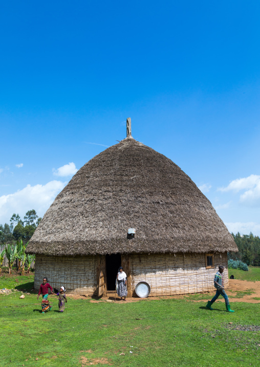 People in front of a Gurage traditional house with thatched roof, Gurage Zone, Butajira, Ethiopia