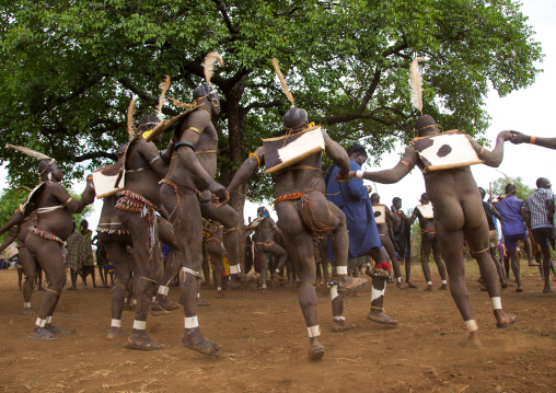 Bodi tribe fat men during Kael ceremony, Omo valley, Hana Mursi, Ethiopia