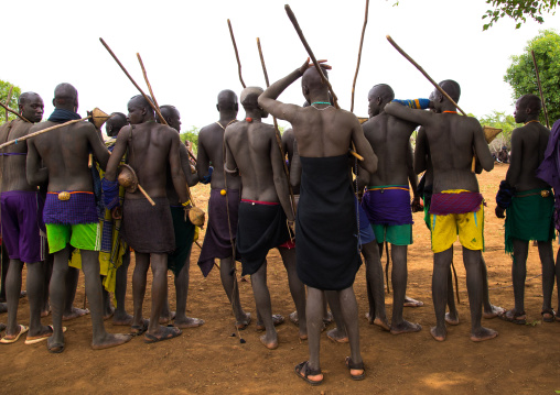 Young men during the fat men ceremony in Bodi tribe, Omo valley, Hana Mursi, Ethiopia