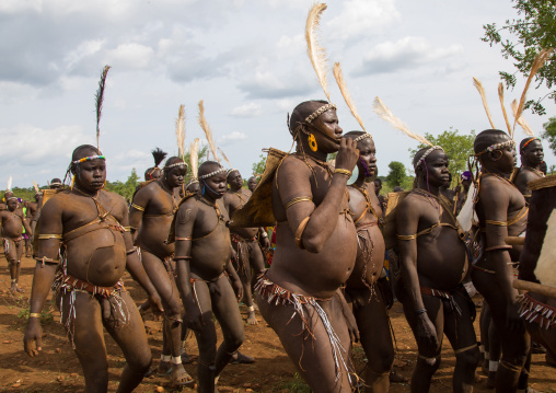 Bodi tribe fat men during Kael ceremony, Omo valley, Hana Mursi, Ethiopia