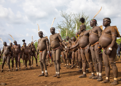 Bodi tribe fat men during Kael ceremony, Omo valley, Hana Mursi, Ethiopia