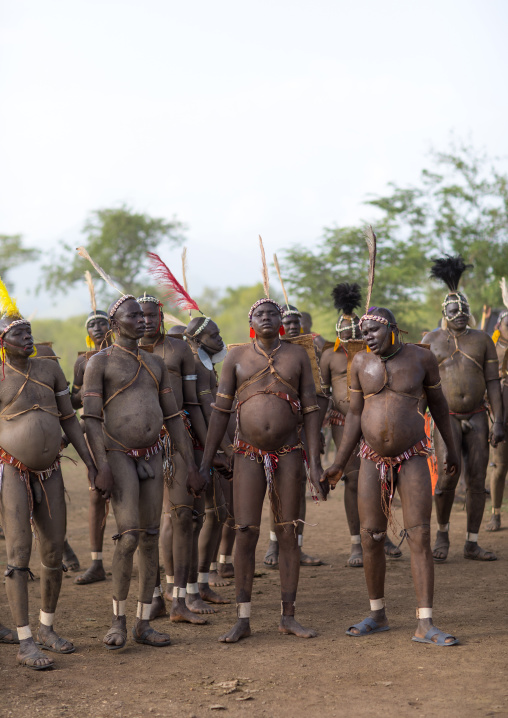 Bodi tribe fat men during Kael ceremony, Omo valley, Hana Mursi, Ethiopia