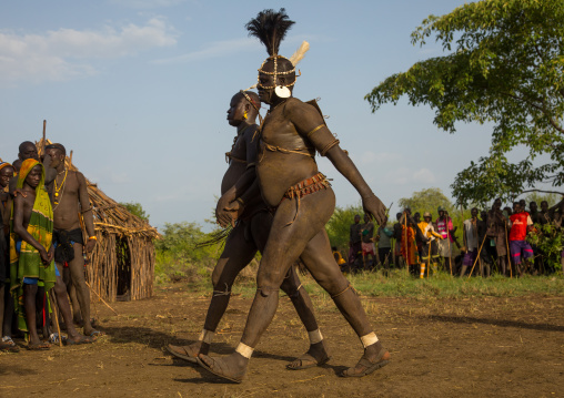Bodi tribe fat men running during Kael ceremony, Omo valley, Hana Mursi, Ethiopia
